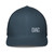 Navy structured closed-back trucker cap with embroidered DAD all caps logo, front view — DAD all caps