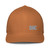 Caramel structured closed-back trucker cap with embroidered DAD all caps logo, front view — DAD all caps