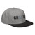 Black/Gray structured high-profile six-panel snapback hat with embroidered Grill DAD logo, right-front view — DAD all caps