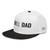 Black/White structured high-profile six-panel snapback hat with embroidered Grill DAD logo, left-front view — DAD all caps
