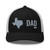 Black/White six-panel mesh-back trucker cap with embroidered Texas DAD logo, front view — DAD all caps