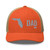 Rustic Orange/Khaki six-panel mesh-back trucker cap with embroidered Florida DAD logo, front view — DAD all caps