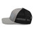 Heather Black six-panel mesh-back trucker cap with embroidered Florida DAD logo, left side view — DAD all caps