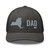 Charcoal six-panel mesh-back trucker cap with embroidered New York DAD logo, front view — DAD all caps