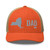 Rustic Orange/Khaki six-panel mesh-back trucker cap with embroidered New York DAD logo, front view — DAD all caps