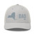 Silver six-panel mesh-back trucker cap with embroidered New York DAD logo, front view — DAD all caps