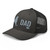 Charcoal six-panel mesh-back trucker cap with embroidered New York DAD logo, left-front view — DAD all caps