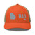Rustic Orange/Khaki six-panel mesh-back trucker cap with embroidered Georgia DAD logo, front view — DAD all caps