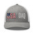Heather Grey/White six-panel mesh-back trucker cap with embroidered USA DAD logo, front view — DAD all caps