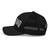 Black six-panel mesh-back trucker cap with embroidered USA DAD logo, left side view — DAD all caps