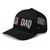 Black six-panel mesh-back trucker cap with embroidered USA DAD logo, left-front view — DAD all caps