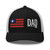 Black/White six-panel mesh-back trucker cap with embroidered Flag DAD logo, front view — DAD all caps
