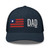 Navy six-panel mesh-back trucker cap with embroidered Flag DAD logo, front view — DAD all caps