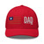 Red six-panel mesh-back trucker cap with embroidered Flag DAD logo, front view — DAD all caps