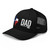 Black six-panel mesh-back trucker cap with state flag color embroidered Texas DAD logo, left-front view — DAD all caps