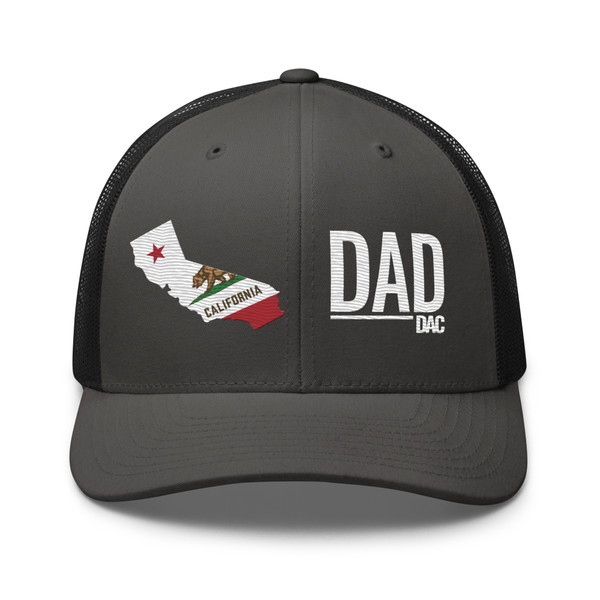 Charcoal/Black six-panel mesh-back trucker cap with state flag color embroidered Cali DAD logo, front view — DAD all caps