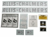 Allis-Chalmers WD 1948-1953 Black Vinyl Cut Decal Set, collection of vintage decals and labels for tractor restoration, including 'Allis-Chalmers' logo, traction booster system instructions, and engine-related labels.