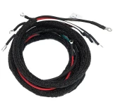 Coiled main wiring harness for Allis-Chalmers WD and WD45 farm tractors, with black braided protective sleeving, visible red, white, and green wires, and metal terminal ends.
