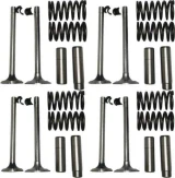 Allis-Chalmers valve train kit components arranged in four groups on a white background, each with two valves, small valve keepers, a pair of valve springs, and two cylindrical valve guides or related parts.