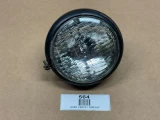 12 Volt Hi Beam Sealed Beam Head Lamp Assembly, automotive sealed beam headlight with clear lens and black housing for vehicle headlights.