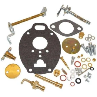 Allis-Chalmers Platinum Carburetor Kit for Allis Chalmers WD45 D17, includes various metal components and gaskets arranged on a surface.