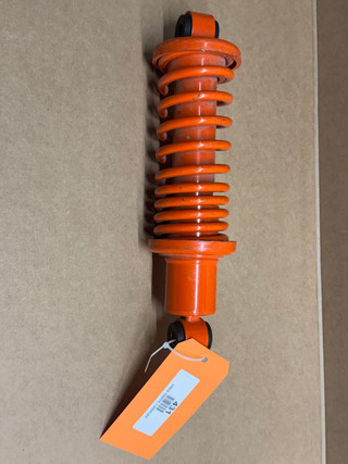 Allis Chalmers WD WD45 Seat Shock Absorber with Spring, display model in bright orange color.