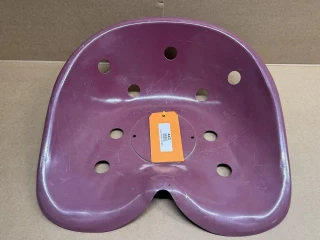 Universal Tractor Seat Pan, display image of a purple tractor seat pan with multiple holes for mounting and ventilation.