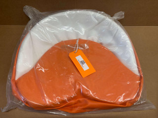 Orange and White Tractor Seat Pad Cushion 19 inches, displayed in a plastic packaging for sale or display.