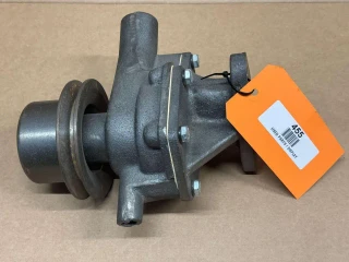 Water Pump for Allis-Chalmers D17, 170, 175, display view of a used tractor water pump with orange tag labeled 455 and barcode on a cardboard background.