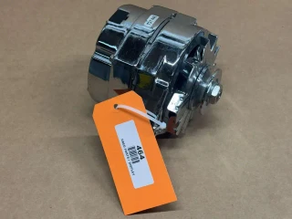 105 Amp One Wire Alternator with Pulley for 6V to 12V Conversion, shiny metallic alternator with a pulley and an orange display tag attached.