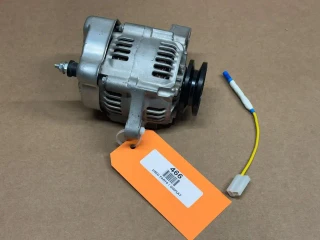 Wire Mini Alternator with Pulley 35 Amp, showing a compact automotive alternator with attached pulley and electrical connector on a brown background.