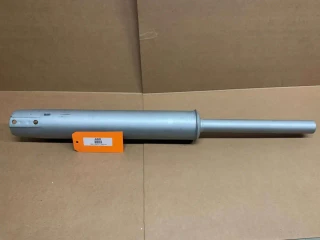 Restoration Quality Muffler Allis Chalmers B C CA D10 D12, metallic muffler with a cylindrical shape and extendable pipe, displayed on a cardboard surface.