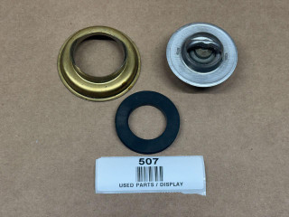 160 Degree Thermostat - Allis Chalmers, Case, Cockshutt, Massey Ferguson display, showing used parts including thermostat components and seals arranged on a brown surface.