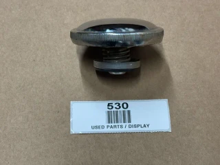 Allis-Chalmers Case Radiator Cap, used display part shown on a beige background with a label marked 530 and barcode.