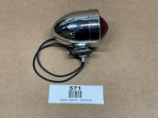 Allis-Chalmers 12 Volt Chrome Bullet Style Tail Light Assembly, display image of a vintage chrome bullet tail light with red lens and wiring, used for tractor or vehicle extension.