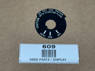 Allis Chalmers Diesel Switch Plate 170 175 180 185 190XT 200 210 220, display of a black circular switch plate with safety instructions and an identification label on a cardboard background.