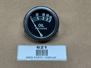Universal Oil Pressure Gauge, round black display with white markings and needle, measuring 0-80 pounds per square inch.