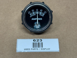 Universal Ammeter Gauge (20-0-20), display of an analog ammeter with a black dial and white markings for discharge and charge, used for measuring electrical current in amperes.