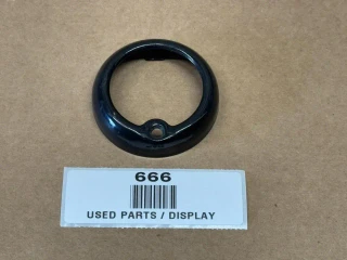 Bullet Tail Light Trim Ring, black metal circular display part for vehicle tail light assembly.