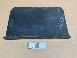 A black metal small back bracket for Allis-Chalmers farm tractors, specifically fits models such as 180, 185, 190, 190XT, 200, 210, 220, and 220 FWA. The bracket has multiple mounting holes and is displayed on a brown surface with a label underneath that reads "709 USED PARTS / DISPLAY."