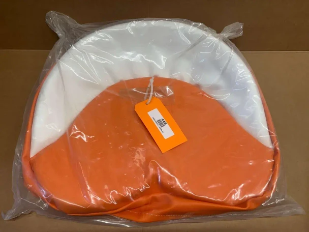 Orange and White Tractor Seat Pad Cushion 19", display with packaging in plastic visible.