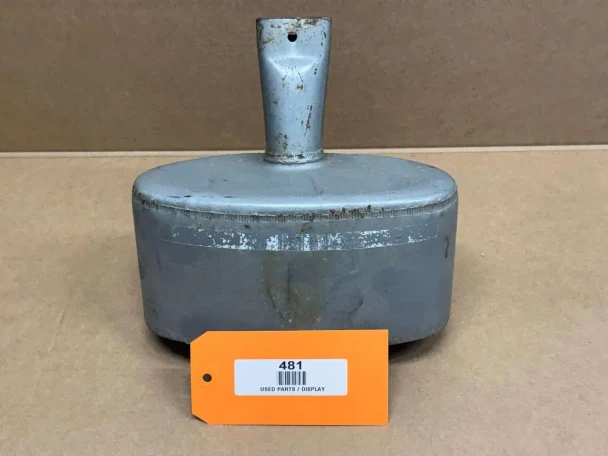 Allis Chalmers B IB C CA Under Hood Muffler, display model of a used tractor muffler with a cylindrical shape and a vertical pipe, placed on a brown background with an orange tag numbered 481.