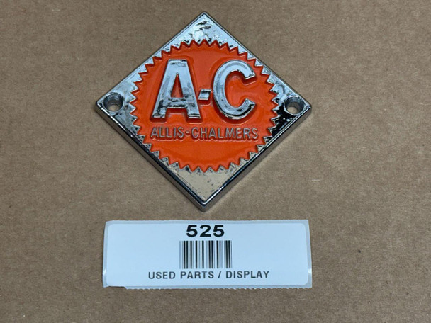 Allis-Chalmers Persian Orange #2 Emblem, a decorative display emblem featuring the initials 'A-C' in silver on an orange background with a metal frame and mounting holes.