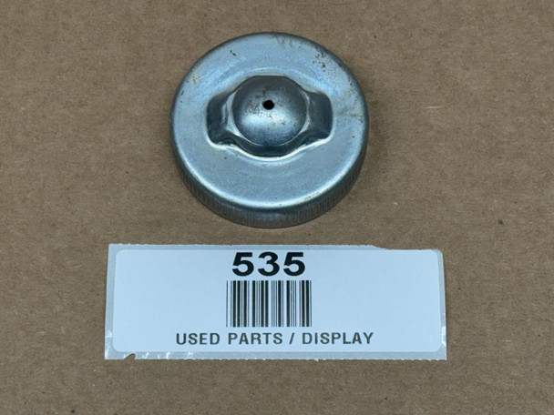 Cap for Fuel, Gas, Oil, or Power Steering (Display), metal cap with a central hexagonal screw and small hole, used for automotive fluid containers