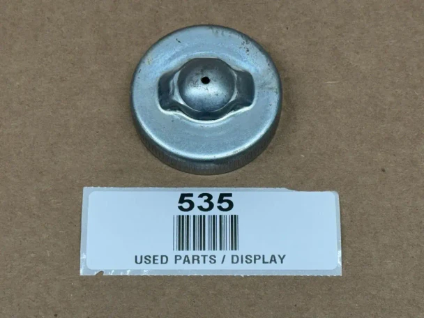 Cap for Fuel, Gas, Oil, or Power Steering, display view of a metallic cap with a rounded shape and central valve, used for vehicle fluid reservoirs.