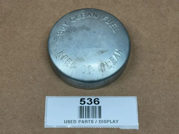 Buy Clean Fuel Fuel Cap for Allis Chalmers and IH, display of a round, metallic fuel cap with embossed text 'Buy Clean Fuel' and 'Fits 1/4'