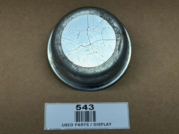 Oil Fill / Breather Cap for Allis-Chalmers, display of a used, dented, and cracked metal oil fill breather cap with a barcode label underneath.