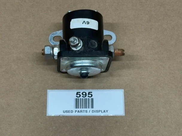 6 or 12 V Starter Solenoid Relay Assembly, displayed on a plain surface with a label showing product information.
