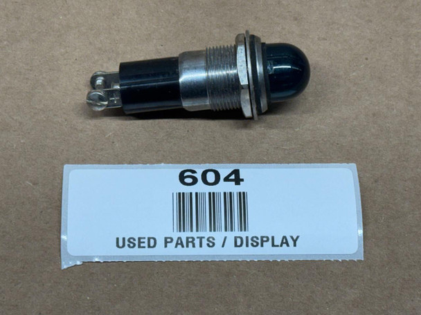 Allis Chalmers Green Power Director Dash Oil Pressure Warning Light (Display), used part with black and metallic components on a brown surface with a white label reading '604, USED PARTS / DISPLAY'.