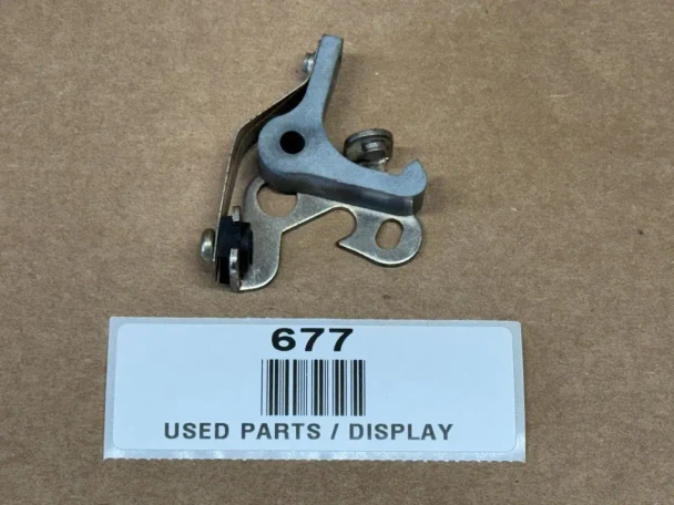 Fairbanks Morse Point Set for FM-J, FM-J4, FM-JE, used parts display showing mechanical component on a brown background with a label marked "677" and "USED PARTS / DISPLAY".